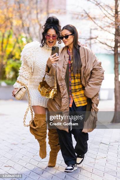 Chloe Flower and Shay Mitchell are seen in the Financial District on December 12, 2021 in New York City.