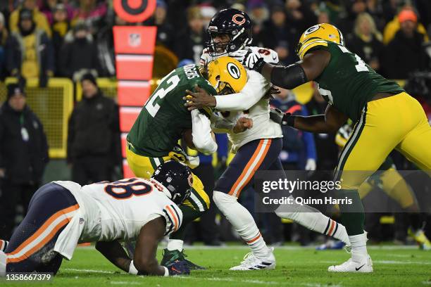 Aaron Rodgers of the Green Bay Packers is sacked by Robert Quinn of the Chicago Bears during the first quarter of the NFL game at Lambeau Field on...
