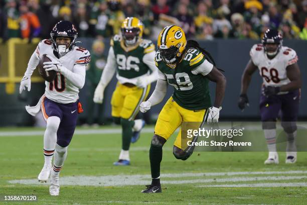 Damiere Byrd of the Chicago Bears runs with the football en route to scoring on a 54-yard touchdown past De'Vondre Campbell of the Green Bay Packers...