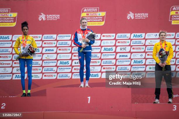 Karoline Bjerkeli Grovdal of Norway , Meraf Bahta of Sweden and Alina Reh during a medal ceremony of Women Senior race during SPAR European Cross...