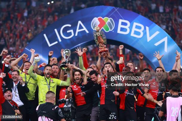 Camilo Vargas and Aldo Rocha of Atlas lift the champions trophy after the final second leg match between Atlas and Leon as part of the Torneo Grita...
