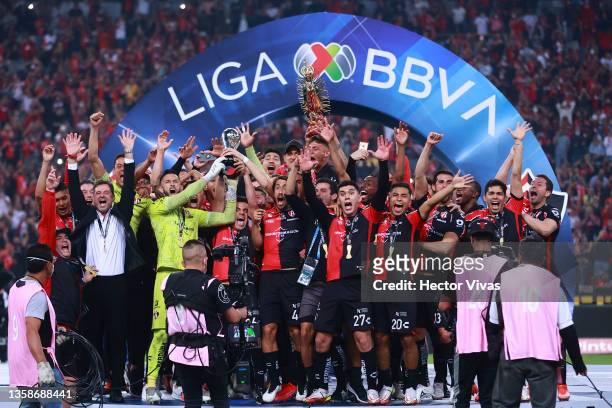 Camilo Vargas and Aldo Rocha of Atlas lift the champions trophy after the final second leg match between Atlas and Leon as part of the Torneo Grita...