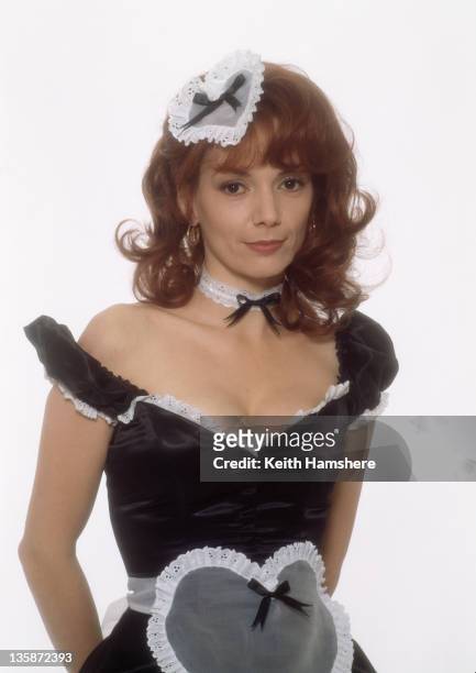 English actress Joanne Whalley wearing a saucy maid's outfit as Lori in the film 'The Man Who Knew Too Little', 1997. The film's working title was...