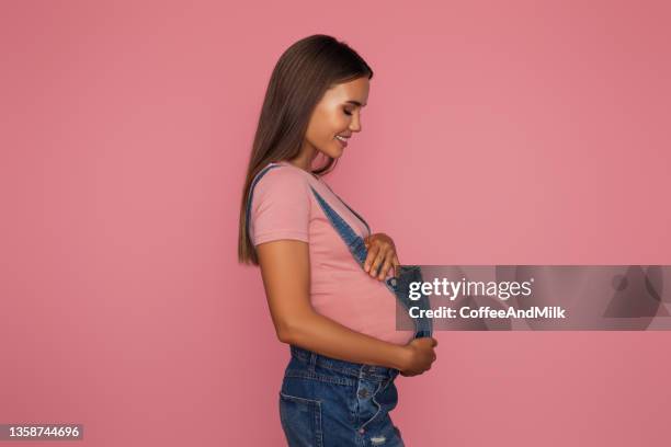 emotional pregnant woman - pregnant isolated stock pictures, royalty-free photos & images