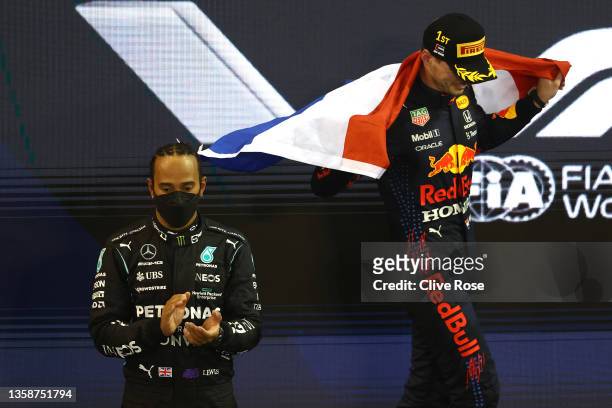 Race winner and 2021 F1 World Drivers Champion Max Verstappen of Netherlands and Red Bull Racing celebrates on the podium during the F1 Grand Prix of...