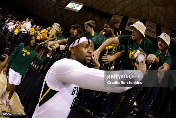 Flo Thamba of the Baylor Bears celebrates with fans following the team"u2019s 57-36 win over Villanova Wildcats at the Ferrell Center on December 12,...