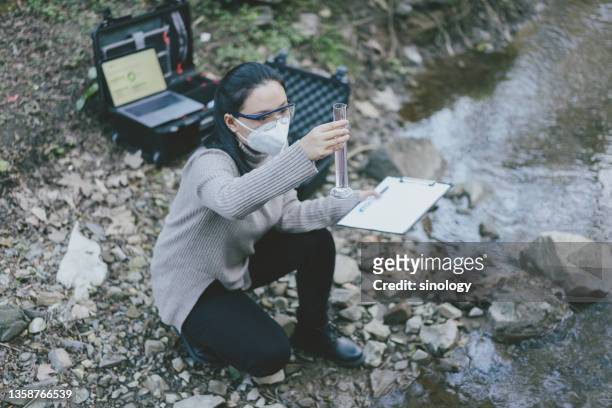 scientist measuring water - data lake stock pictures, royalty-free photos & images