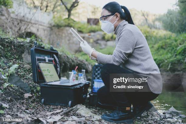 scientist measuring water - ecologist stock pictures, royalty-free photos & images