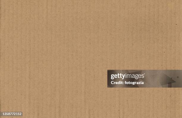 brown corrugated cardboard background - cardboard box photos et images de collection