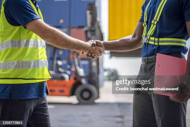 businessmen ceo manager customs broker shake hand shipper cargo agreement packing list certificate of origin insurance including export import entry - contact list stock-fotos und bilder