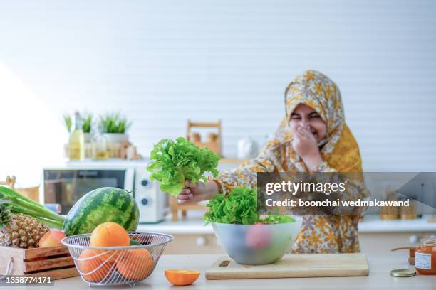 muslim girls do not like vegetable - muslim girl eating stock pictures, royalty-free photos & images