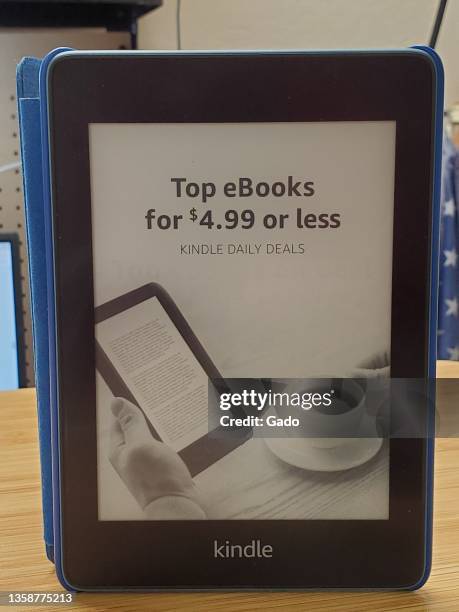 Amazon Kindle Paperwhite e-book reader on wooden surface, Lafayette, California, December 4, 2021. Photo courtesy Tech Trends.