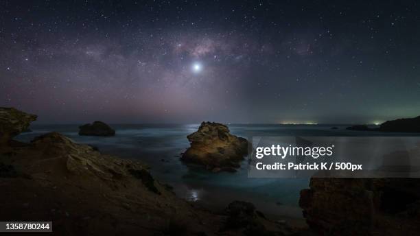 scenic view of sea against sky at night,sorrento,victoria,australia - mornington peninsula stock-fotos und bilder