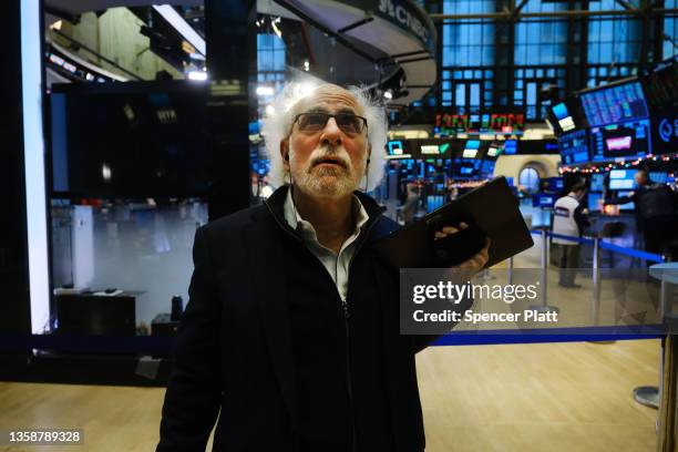 Stock trader Peter Tuchman works on the floor of the New York Stock Exchange on December 13, 2021 in New York City. As investors are still concerned...