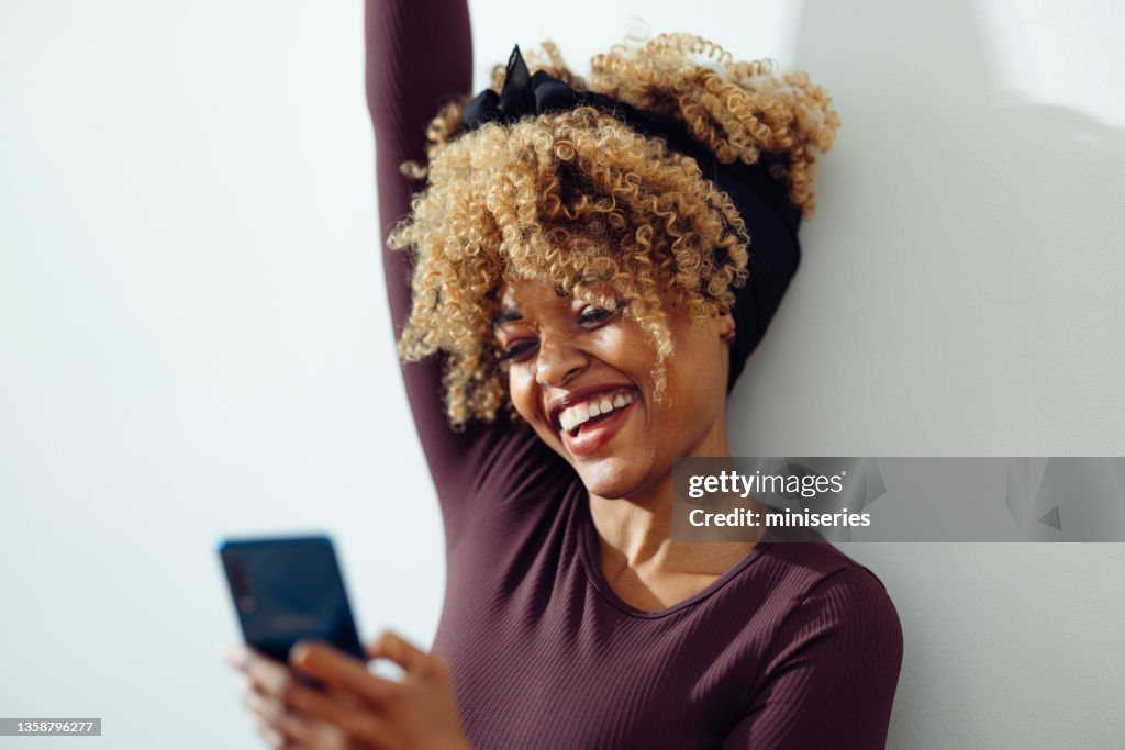 Beautiful Afro-American Woman Getting Good News on the Phone