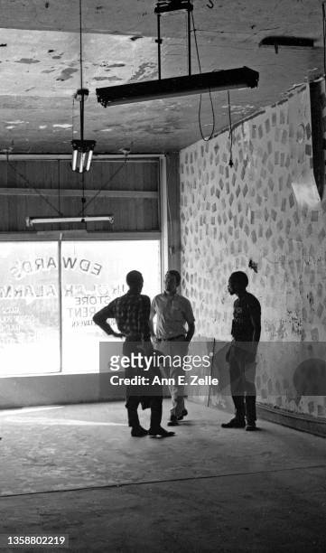 View of, from left, artist Daniel Hetherington, James Houlihan, of the Illinois Sesquicentennial Commission, and artist Jackie Hetherington in an...