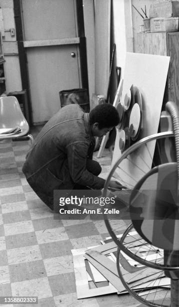 American artist Reginald 'Reggie' Madison works on 'Still Life in Motion,' his entry in an art contest at the Art & Soul community art center , in...