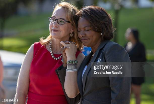 Democratic Senate candidate Rep. Val Demings and former Rep. Gabrielle Giffords share a moment during a visit to a gun violence memorial in Bayfront...