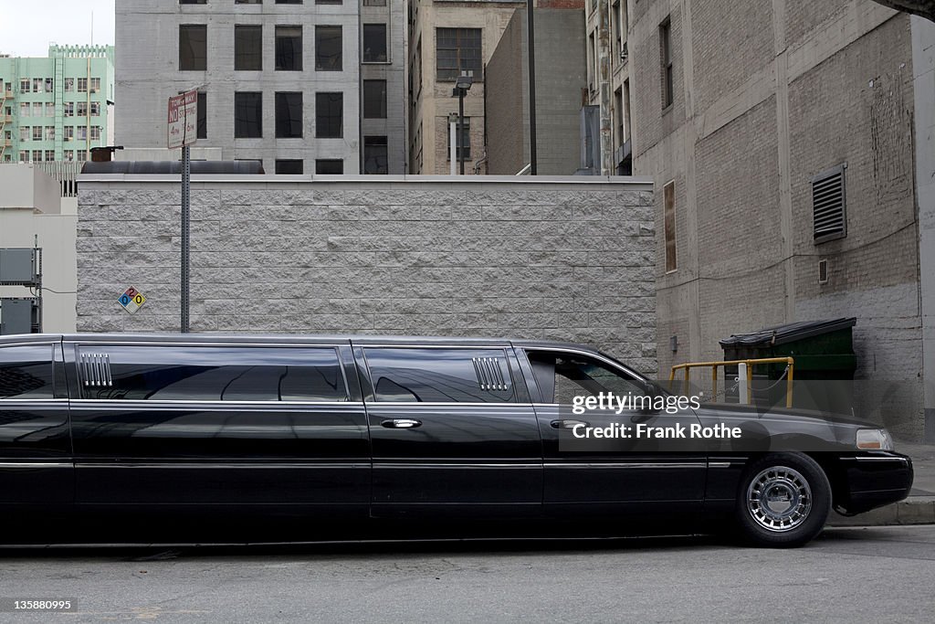 A stretch limo parks downtown