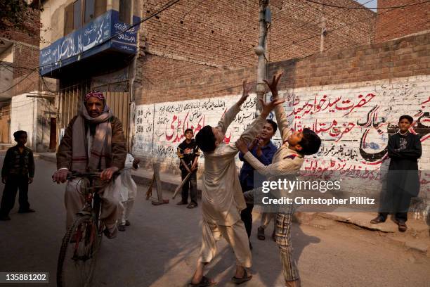 Kids playing Cricket on the streets of Lahore, Pakistan.