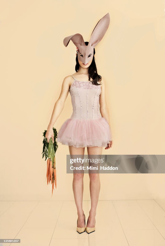 Ballerina Wearing Bunny Mask Holding Carrots