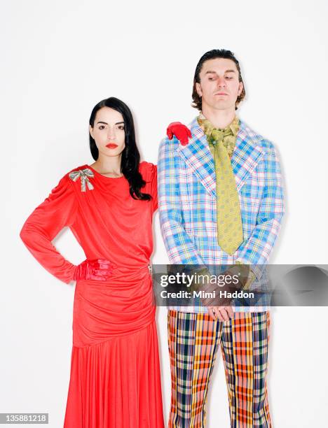 couple with suspicious man - fashion oddities stock pictures, royalty-free photos & images