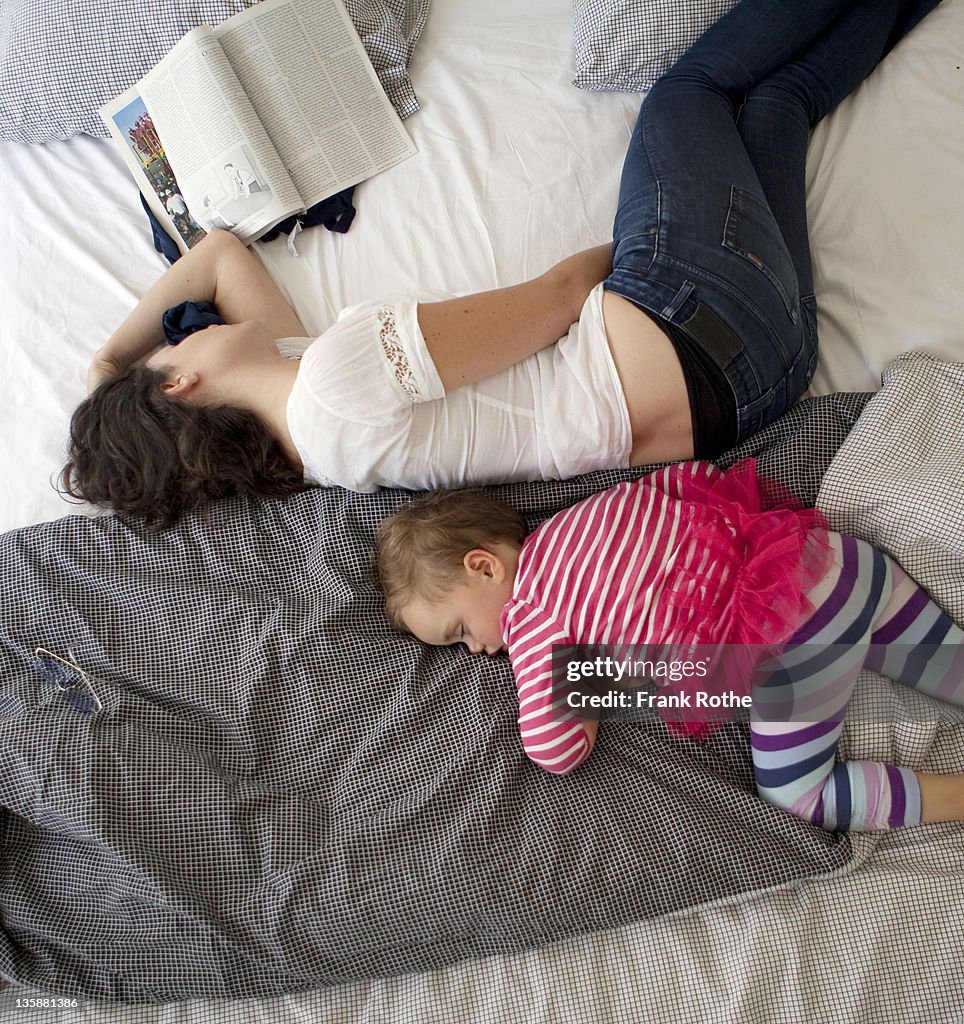 Mother and kid sleeping together in the afternoon