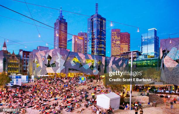 people in federation square, melbourne. - federation square melbourne stock pictures, royalty-free photos & images