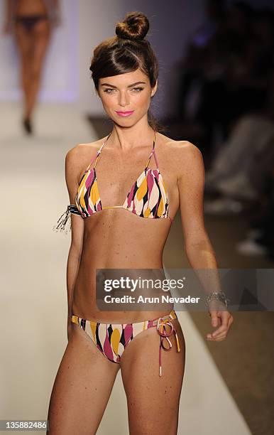 Model walks the runway at the Syla by Sylvie Cachay 2009 collection fashion show during Mercedes Benz Fashion Week Swim at the Raleigh Hotel on July...