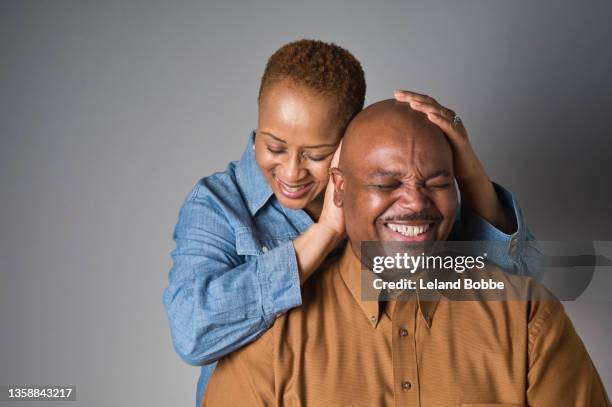 studio portrait of middle aged african american couple - couples studio portrait stock pictures, royalty-free photos & images