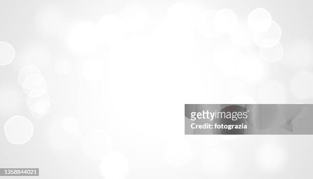 white bokeh lights background - blurry background stockfoto's en -beelden