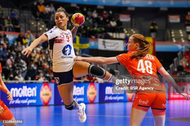 Nora Mork of Norway and Dione Housheer of Netherlands during the 25th IHF Women's World Championship match between Netherlands and Norway at Palacio...