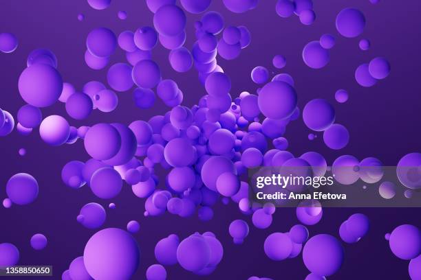 many purple spheres splashing over violet background. demonstrating color of the year 2022 - very peri - sphere stock pictures, royalty-free photos & images