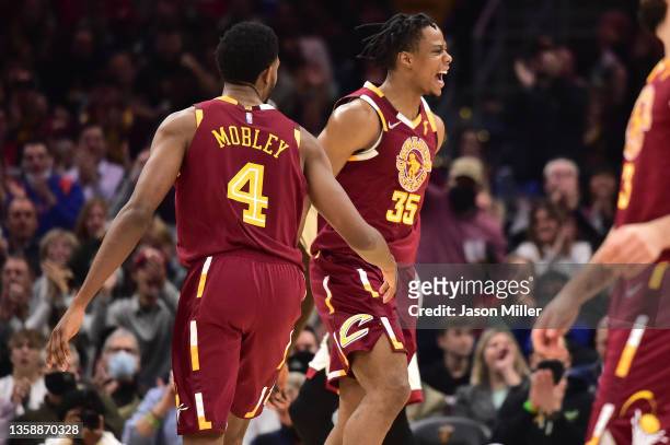 Evan Mobley and Isaac Okoro of the Cleveland Cavaliers celebrate after scoring during the second quarter against the Miami Heat at Rocket Mortgage...