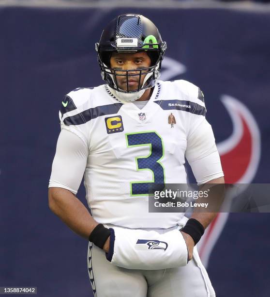 Seattle Seahawks quarterback Russell Wilson warms up before playing the Houston Texans at NRG Stadium on December 12, 2021 in Houston, Texas.