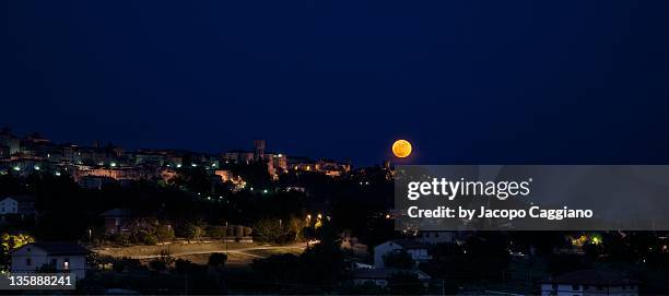 moon in sky at night - jacopo caggiano stockfoto's en -beelden