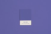 Color swatch with color of the year 2022 - Very Peri. Color trend palette. Top view, flat lay.