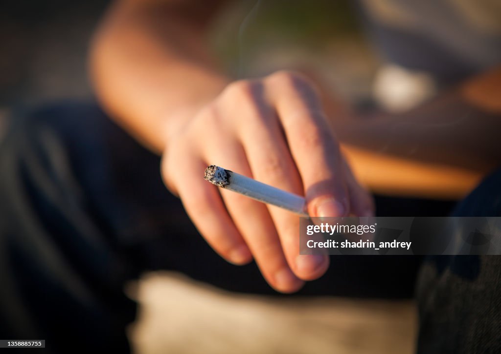 Cigarette in a Hand