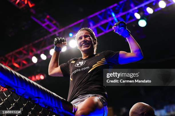 Julianna Pena celebrates after defeating Amanda Nunes of Brazil to win the women's bantamweight title during the UFC 269 event at T-Mobile Arena on...