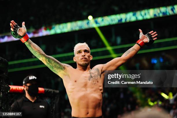 Charles Oliveira of Brazil enters the octagon for his lightweight title fight against Dustin Poirier during the UFC 269 event at T-Mobile Arena on...