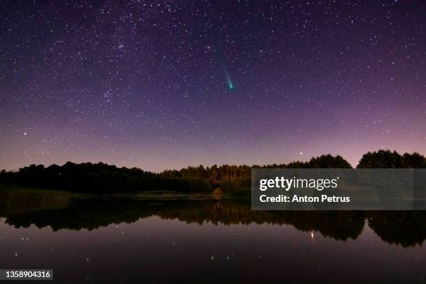 comet c/2021 a1 leonard  at dawn over the river. - shooting star stock pictures, royalty-free photos & images