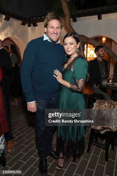 Curtis Stone and Lindsay Price attend the holiday reception to celebrate The Ucross Cookbook on December 13, 2021 in Beverly Hills, California.