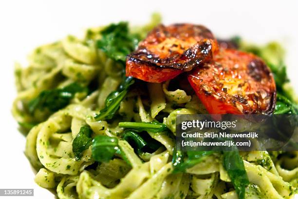 grilled tomato over pasta - nieuwendijk stock pictures, royalty-free photos & images