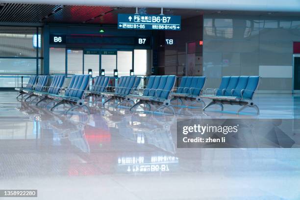 rows of empty chairs at train station - airport wall stock pictures, royalty-free photos & images