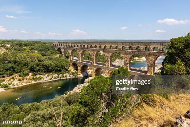 pont du gard (languedoc-roussillon, france) - pont du gard aqueduct stock pictures, royalty-free photos & images
