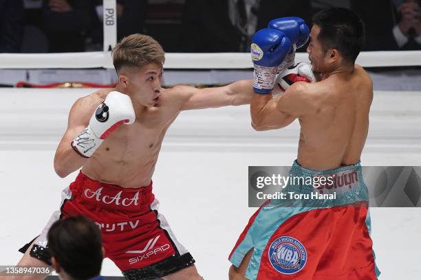 Naoya Inoue of Japan punches Aran Dipaen of Thailand during the WBA Super Bantamweight and IBO Bantamweight title bout at Ryogoku Kokugikan on...