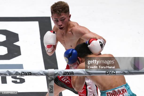 Naoya Inoue of Japan punches Aran Dipaen of Thailand during the WBA Super Bantamweight and IBO Bantamweight title bout at Ryogoku Kokugikan on...