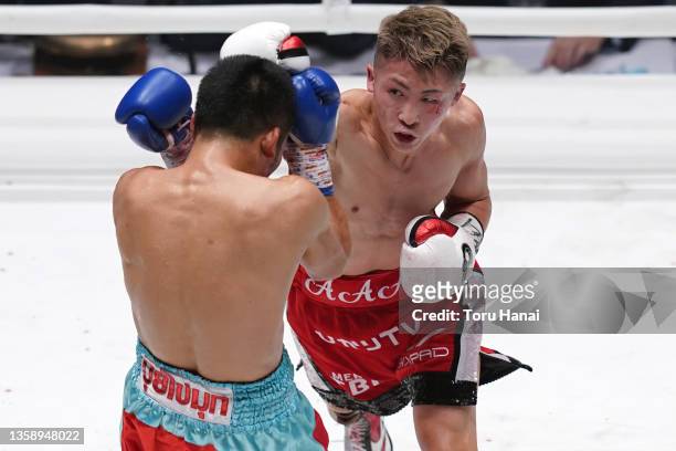 Naoya Inoue of Japan punches Aran Dipaen of Thailand during the WBA Super Bantamweight and IBO Bantamweight title bout at Ryogoku Kokugikan on...