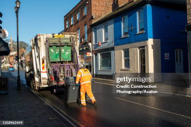 Council bin worker collecting domestic waste from households, Ipswich, Suffolk, UK, 17th December 2020.