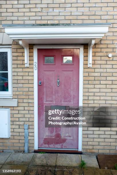 Paint faded on a house front door, 17th December 2020.